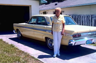 Rachel Veitch stand in front of her 1964 Mercury Mercury Comet Caliente