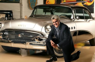 Jay Leno in front of his 1955 Buick Roadmaster